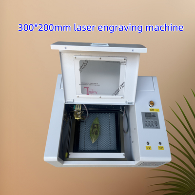 3020 300 * 200mm CNC حفر ليزر CO2 للنسيج الجلدي من الخشب الأكريليك